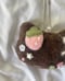 Image of cosmokitty plushie in chocolate strawberry