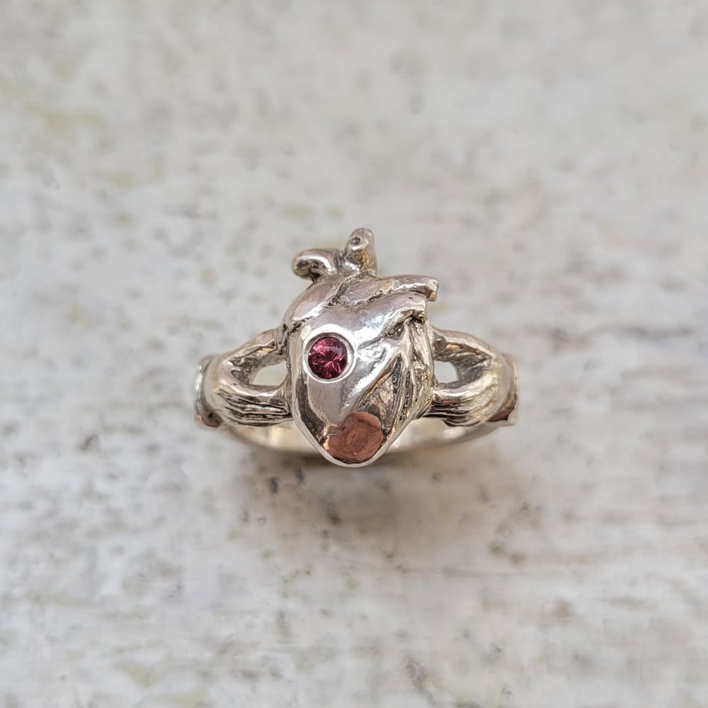 Image of Claddagh ring with Orange Red Spinel