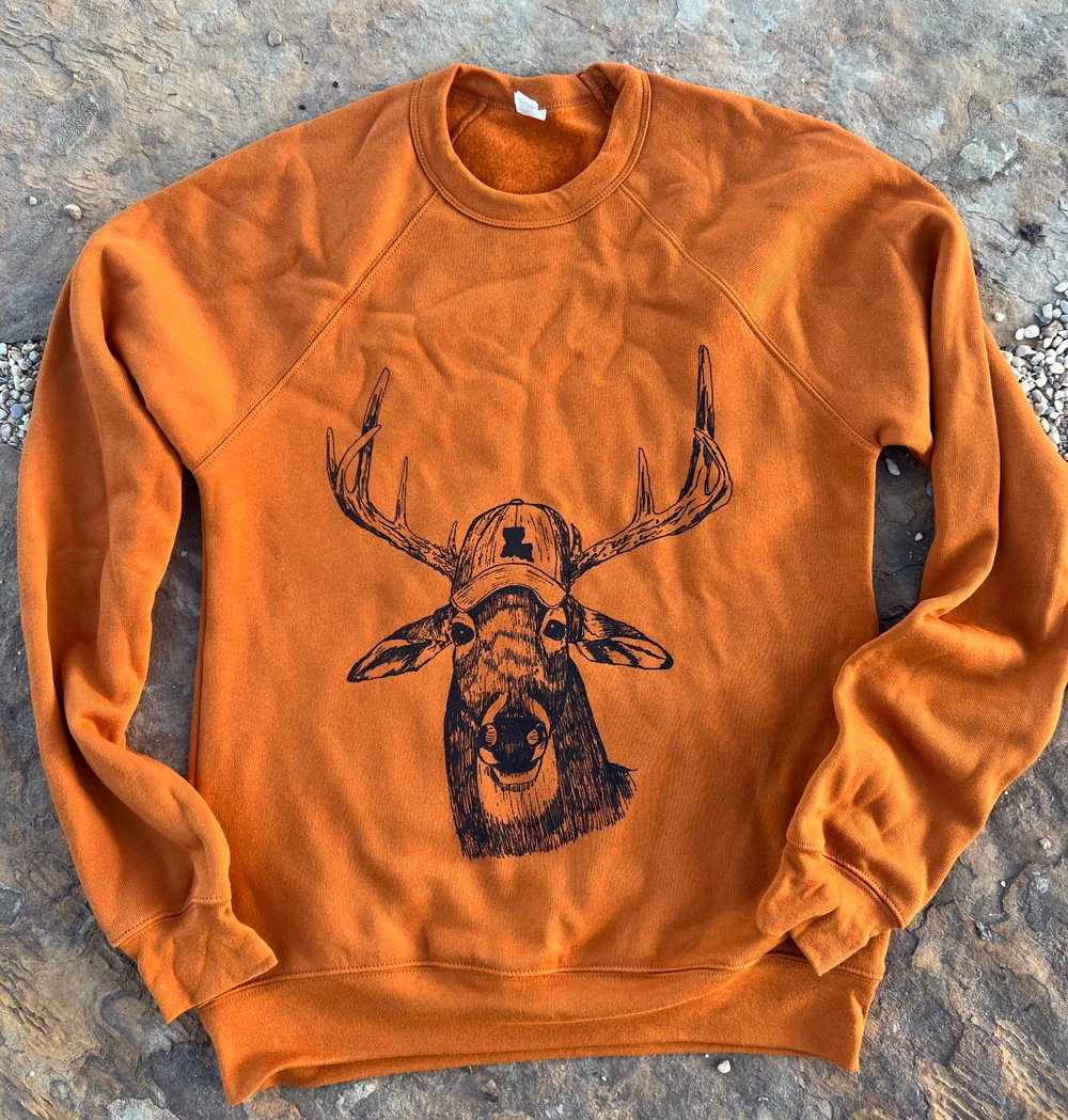 Image of Adult Deer in Hat Sweatshirt in Autumn Orange