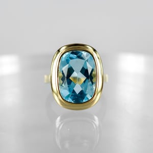 Image of 9ct yellow gold large blue topaz cocktail ring. PJ6013