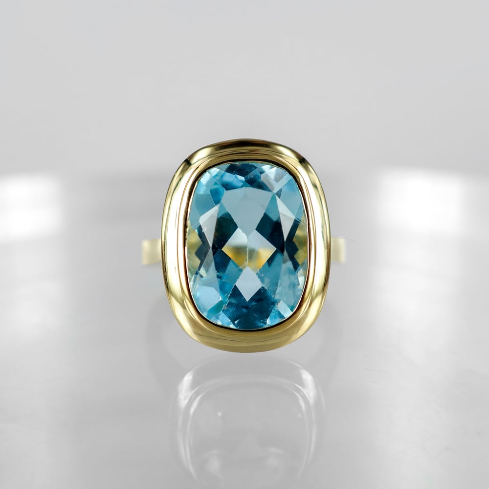 Image of 9ct yellow gold large blue topaz cocktail ring. PJ6013