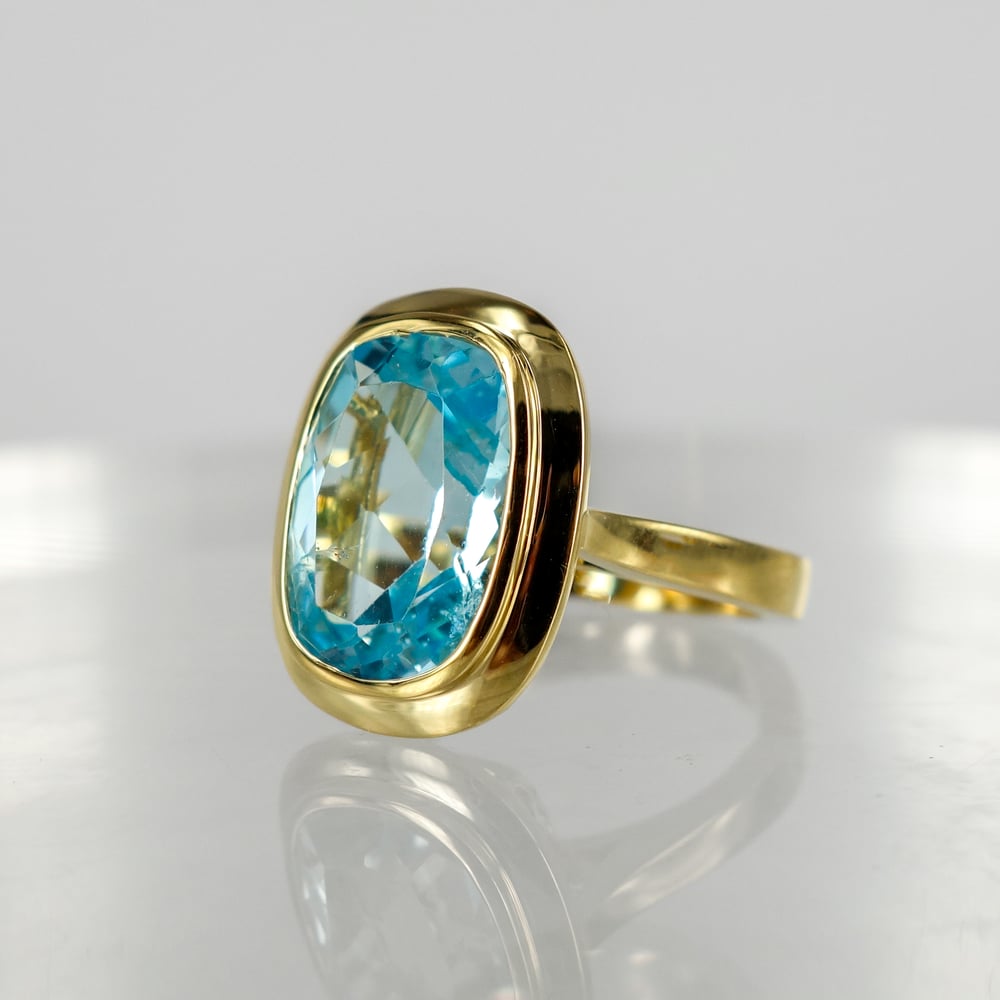 Image of 9ct yellow gold large blue topaz cocktail ring. PJ6013