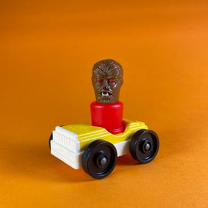 Image of Wolf man peg toy and Fisher-Price car