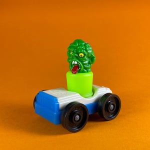 Image of Toxie peg toy and Fisher-Price car