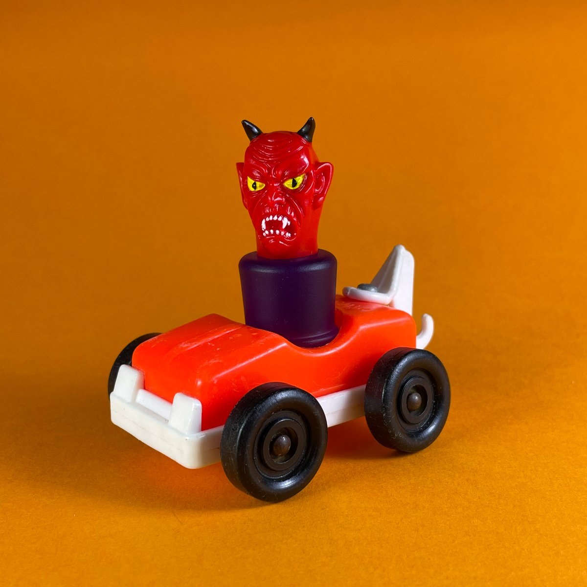 Image of Satan peg toy and an Educalux tow truck