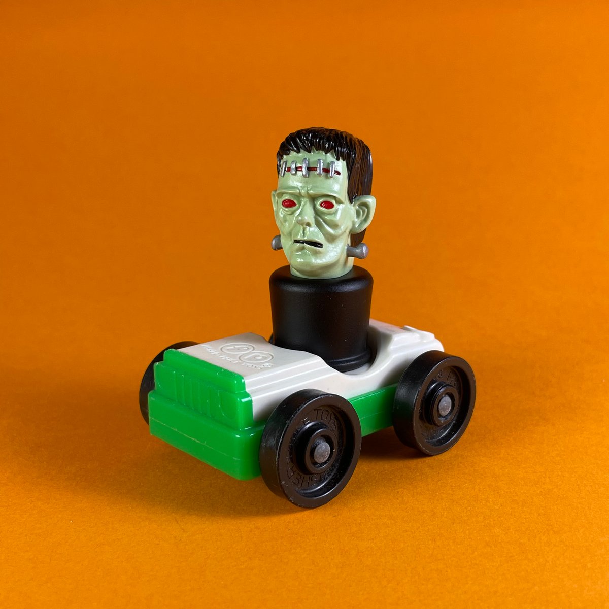 Image of Frankenstein peg toy and Fisher-Price car