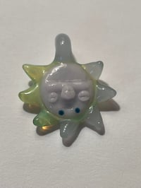 blue green and purple sun