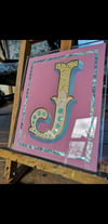 Reverse gilded glass sign