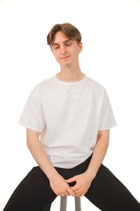 Image 1 of Athletic Play. White Tee