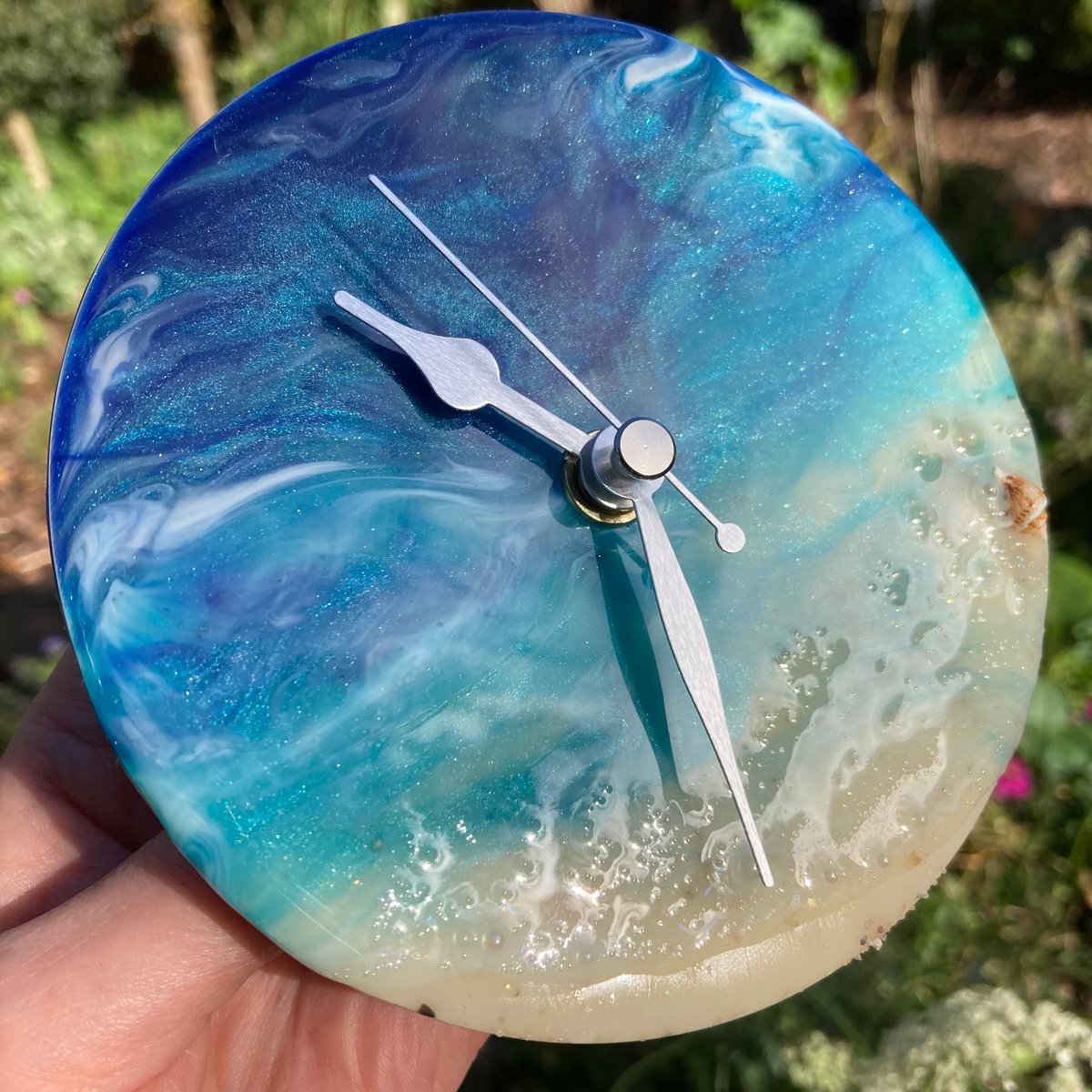 Image of 'Sea-D' shelf clock with stand.