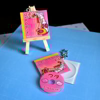 Image 1 of Uta CD Charm - 2.5"