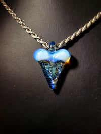 Image 1 of Wig-wag implosion shark tooth pendant.