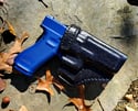 Glock G17 Blacked out avenger holster.