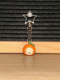 Image 1 of oramge keychain