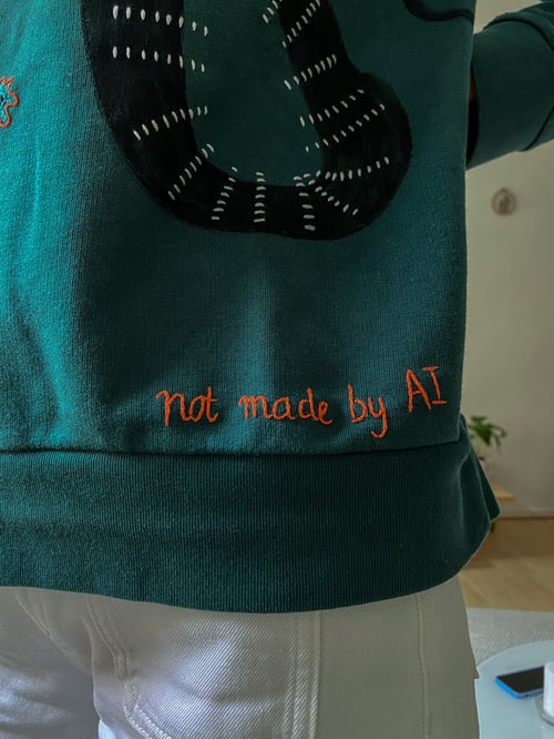 Image of Slow arrow of beauty - original hand embroidery on organic cotton sweatshirt, size Medium, Upcycled