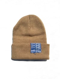 Image of raised different beanie in tan