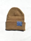 raised different beanie in tan