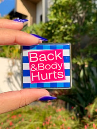 Image 1 of "Back & Body Hurts" Pin | Satire Logo Art