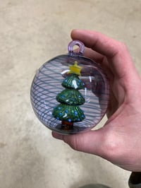 Image of Tree in an ornament purple with blue sparkle spiral 