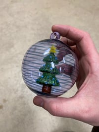 Image of Tree in an ornament purple with blue sparkle spiral 