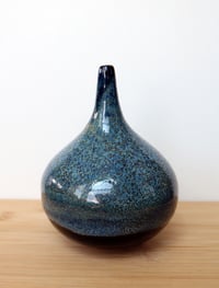 Image 1 of blue on black thin neck vase