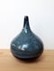 Image of blue on black thin neck vase