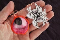 Image 1 of keychain set (eyeball and spider)