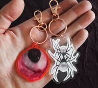 Image 2 of keychain set (eyeball and spider)