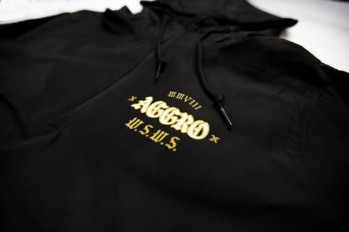 Image of AGGRO BRAND "Rumble" Women's Crop 1/4 Zip Windbreaker