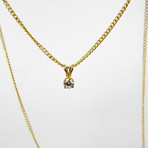 Image of 9ct yellow gold .20pt FSI2 diamond pendant. PJ5976