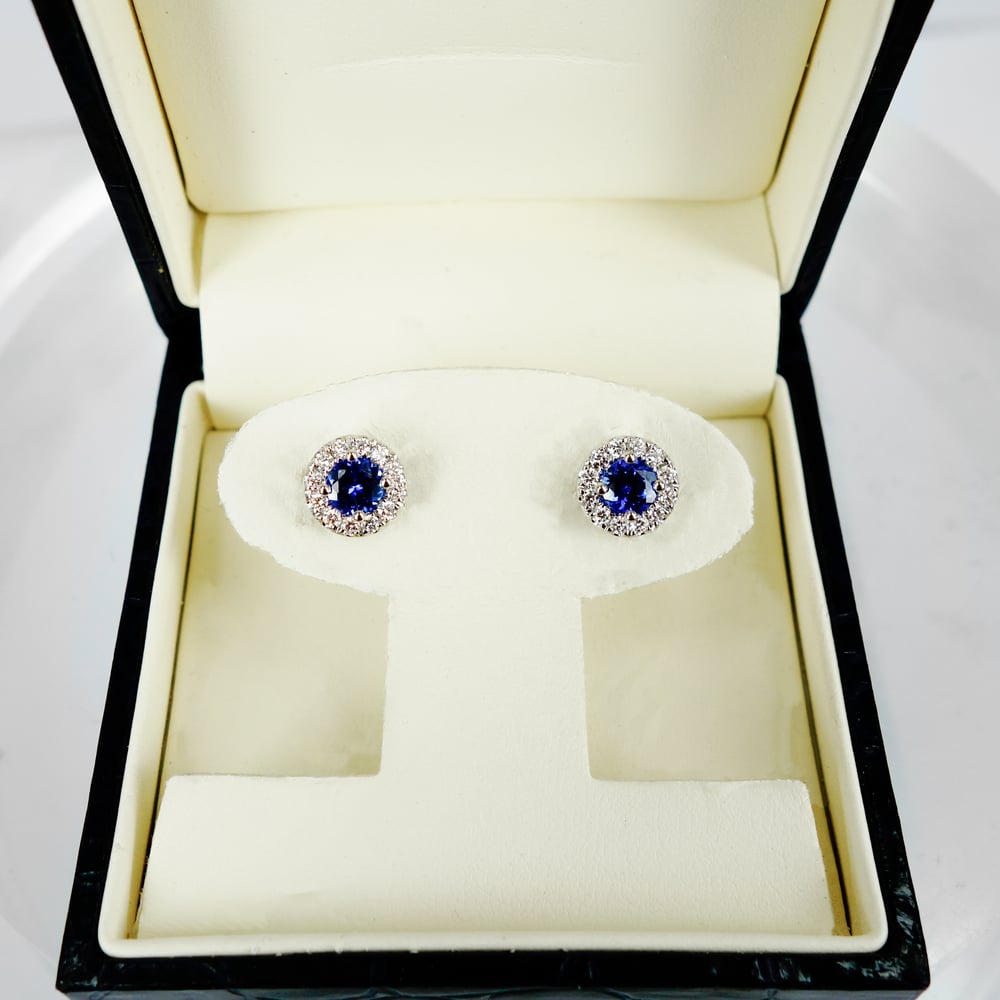 Image of 14ct white gold Tanzanite and diamond cluster earrings. PJ6003