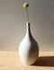 Image of matte white textured thin neck vase