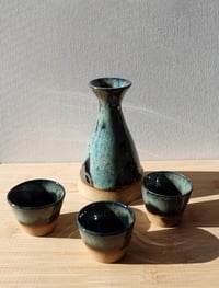 Image 1 of angled green and black sake set