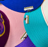 NotFamous “Most Wanted” 6 Star Brim Clip
