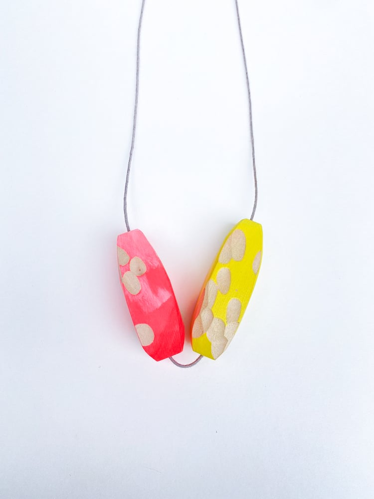 Image of Wooden pendant - bright pink and yellow