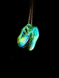 Image 1 of Titan v1 Tyrannosaurus rex skull pendant with illuminati/galaxy teeth.