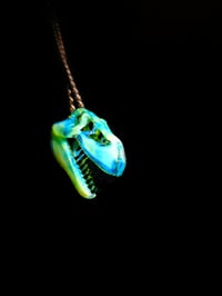 Image 2 of Titan v1 Tyrannosaurus rex skull pendant with illuminati/galaxy teeth.