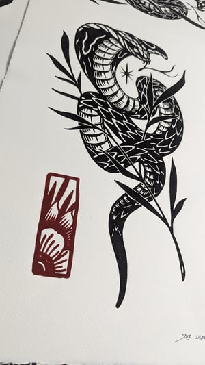 Lino print "SNAKE"