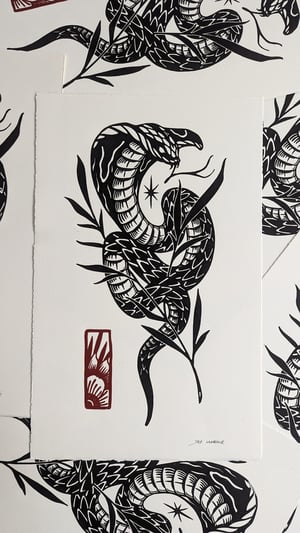 Lino print "SNAKE"