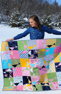 Image 1 of Spinning Stars Quilt, featuring In the Meadow