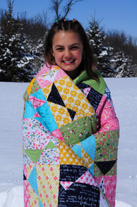 Image 3 of Spinning Stars Quilt, featuring In the Meadow