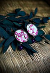 Arracades rodones Ume roses sobre fons ivori
