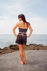 Image 1 of Wet - Girls tramp stamp black with white contrast stitch microfiber board short