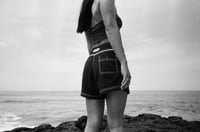 Image 3 of Wet - Girls tramp stamp black with white contrast stitch microfiber board short