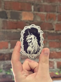 Image 1 of black/grey unicorn sticker
