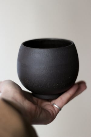 Image of raw clay black mug