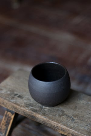 Image of raw clay black mug
