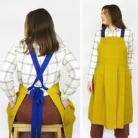 Image 2 of Pleated Split Leg Apron with Adjustable Crossback Straps. Mustard Canvas No25