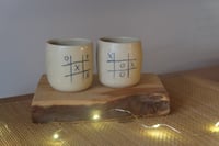 Image 1 of Tic-tac-toe espresso mug.