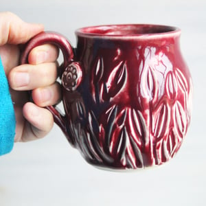 Image of Spring Flowers Carved Coffee Cup, Ox Blood Red Gardeners Pottery Mug, Handmade in USA